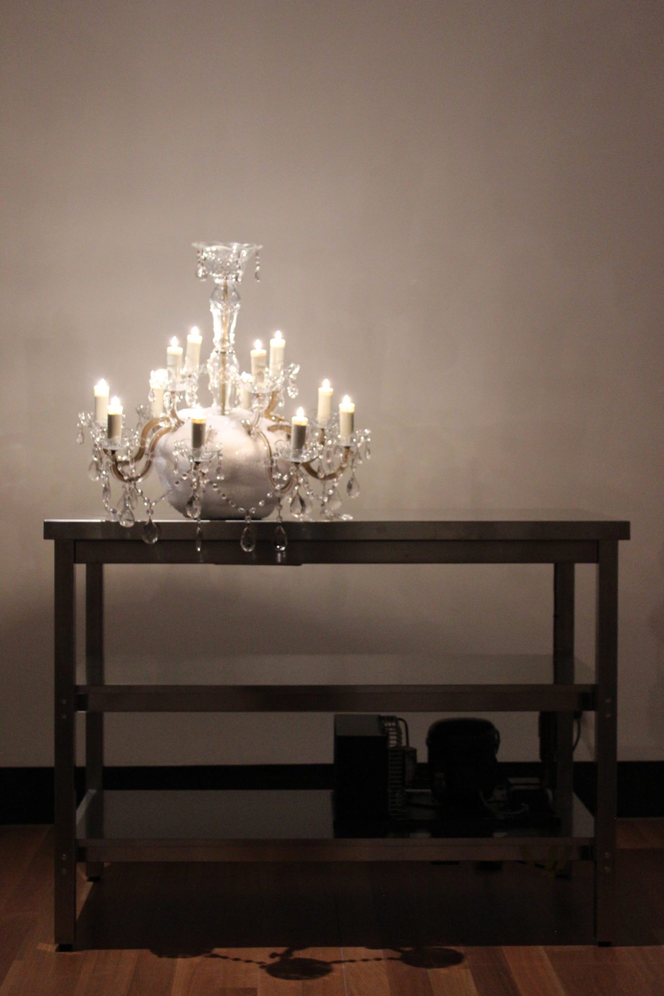 Nicholas Folland, A job for tomorrow..., 2009, Refrigeration unit, stainless steel bench, chandelier, 150 x 120 x 80 cm, Latrobe Regional Gallery Collection, purchased 2009.