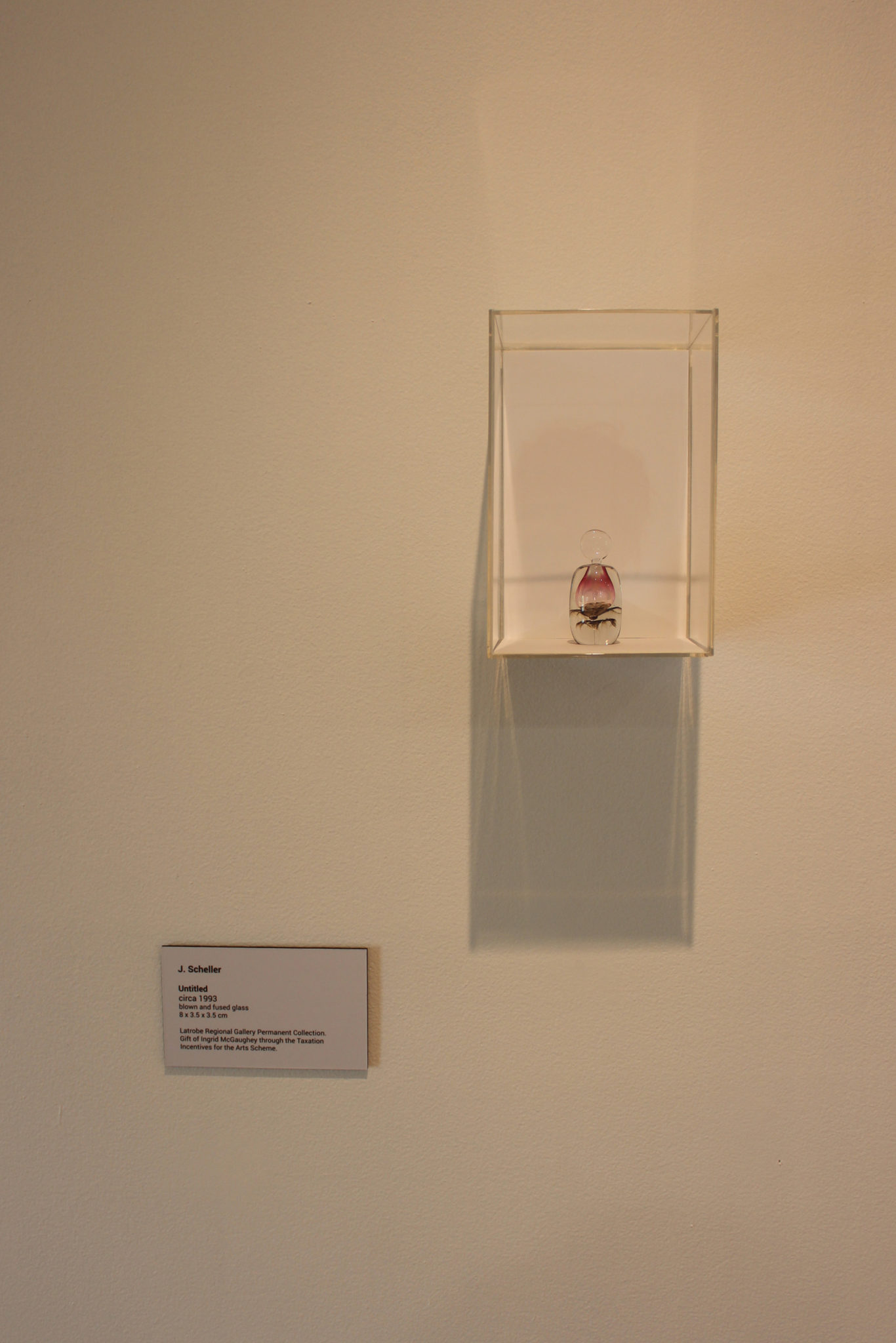Exhibition documentation of Bloom, shown in The Lane, Latrobe Regional Gallery, 2019. Pictured: J. Scheller, Untitled, circa 1993, Blown and fused glass, 8 x 3.5 x 3.5 cm, Latrobe Regional Gallery, Ingrid McGaughey Glass Collection, donated 1996.