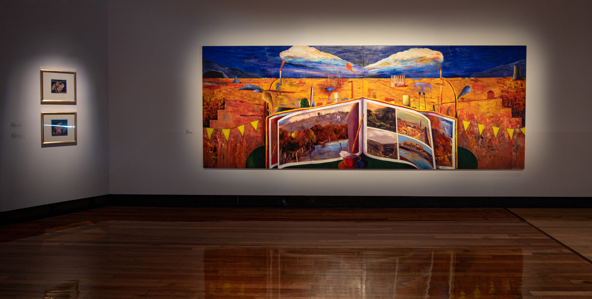 Exhibition documentation of 50 Years, 50 Artists, at Latrobe Regional Gallery, 2021. Pictured: Three works by Bill Young. (left top to bottom) Bill Young, Night Hill I and Night Hill II, 1987 Synthetic polymer paint on paper, 19 x 17 cm, Latrobe Regional Gallery Collection, purchased 1988. (right) Bill Young, Spirit of Morwell, 1990, Acrylic on MDF, Two panels 183 x 240 cm each, Latrobe Regional Gallery Collection, commissioned by the City of Morwell, 1990.