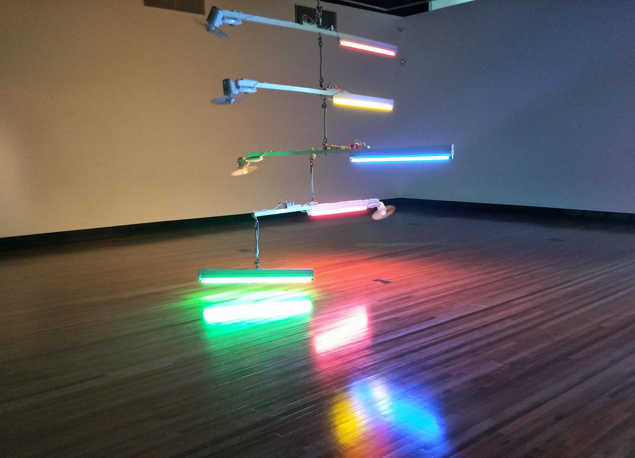 Exhibition documentation of Ross Manning, Spectra XIII, 2017, Fluorescent lights, fans, timber, acrylic paint, steel cable, Courtesy the artist. Shown gallery 1, Latrobe Regional Gallery, 2019.